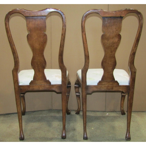 2330 - A set of six walnut veneered Queen Anne style dining chairs with shaped splats over upholstered drop... 