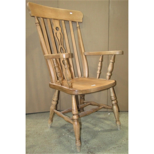 2332 - A modern reproduction beechwood Windsor lathe back armchair with central pierced splat