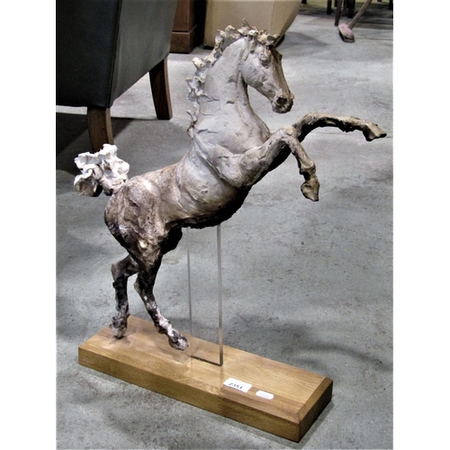 2351 - An attractive clay pottery sculpture of a rearing horse/stallion raised on a contemporary light oak ... 