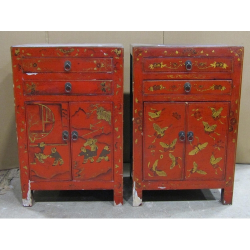 2374 - A matched pair of Chinese crimson lacquered low side cupboards with decorative gilt highlighted figu... 