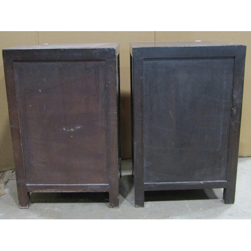 2374 - A matched pair of Chinese crimson lacquered low side cupboards with decorative gilt highlighted figu... 