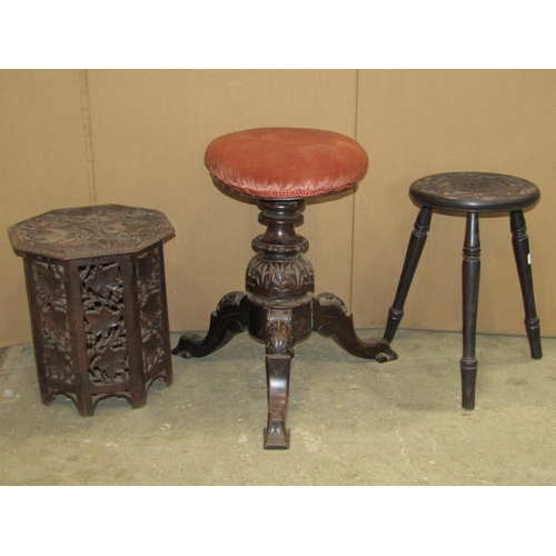 2376 - A late Victorian/Edwardian music stool with circular upholstered and revolving seat, raised on shape... 