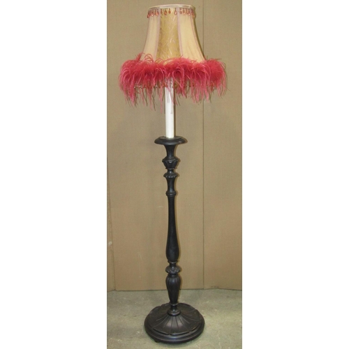 2381 - An ebonised wooden standard lamp in the form of a candle stand with turned stem, petal collar and mo... 