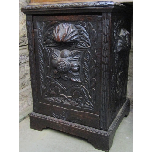 2384 - A Victorian dark stained carved oak wall hanging cupboard enclosed by a pair of panelled doors, with... 