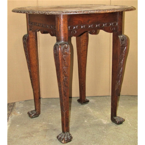 2389 - A Victorian oak occasional table of circular form with carved foliate detail, raised on square taper... 