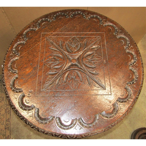 2389 - A Victorian oak occasional table of circular form with carved foliate detail, raised on square taper... 