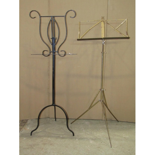 2394 - An iron work floorstanding music stand, together with a further folding example (2)