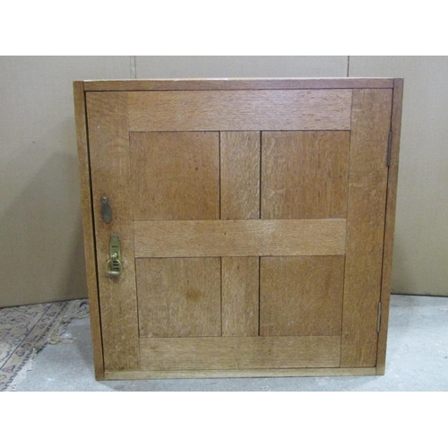 2116 - An Arts & Crafts style craftsman made medium oak cupboard with exposed dovetail construction and enc... 