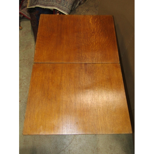 2398 - A medium oak X framed folding campaign or coaching type table of rectangular form