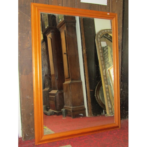 2407 - A large contemporary wall mirror of rectangular form with moulded pine frame, 120cm x 90cm, together... 