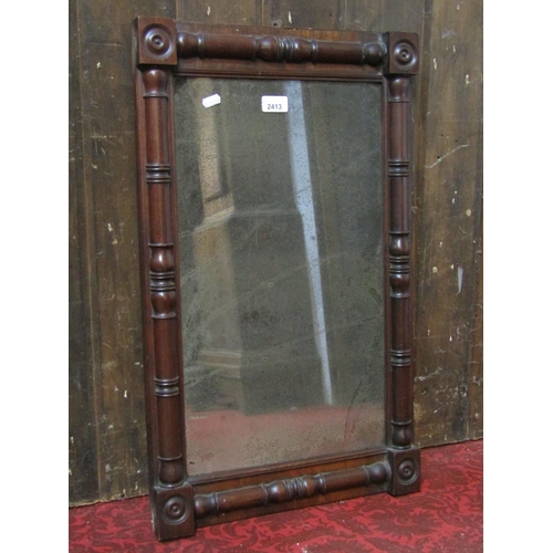 2413 - A small 19th century mahogany chimney glass of rectangular form with split column surround and bulls... 