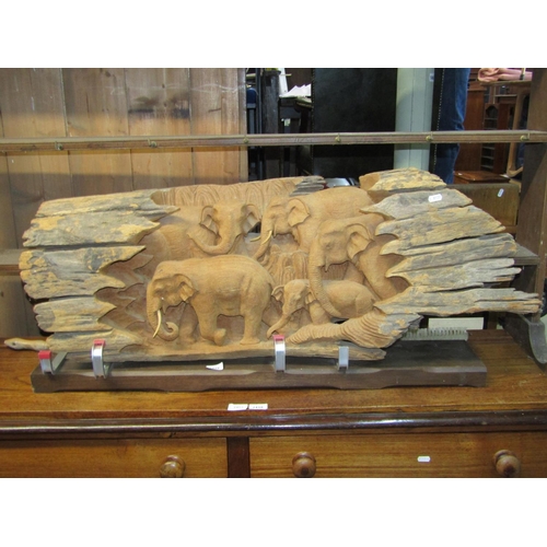 2419 - A carving/study of a troop of African Elephants, carved from a weathered rustic log, mounted on a co... 