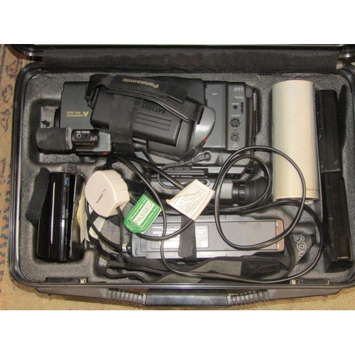 2140 - A cased portable Panasonic MS50 VHS hand held video recording camera and accessories, together with ... 