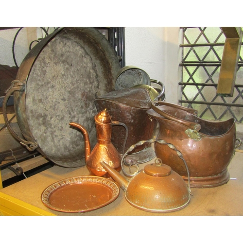 2160 - One lot of antique and later metal wares to include two copper coal helmets of varying design, an ar... 