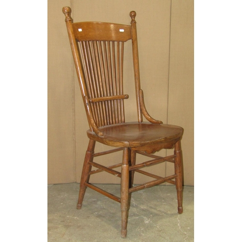 2247 - A Windsor stained ash and elm hoop and stick back elbow chair with saddle shaped seat raised on ring... 