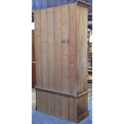 2117 - An Edwardian walnut single wardrobe, the moulded panelled front enclosed by a central three quarter ... 