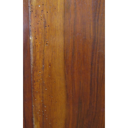 2117 - An Edwardian walnut single wardrobe, the moulded panelled front enclosed by a central three quarter ... 