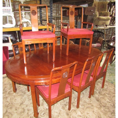 2312 - A Chinese hardwood D end extending dining table, the panelled top with two additional leaves raised ... 