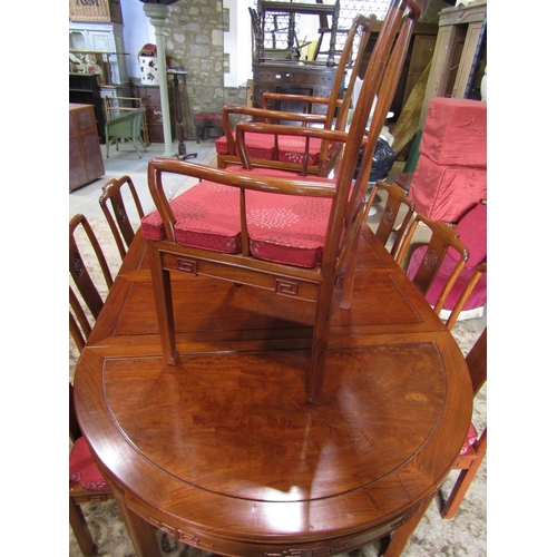 2312 - A Chinese hardwood D end extending dining table, the panelled top with two additional leaves raised ... 