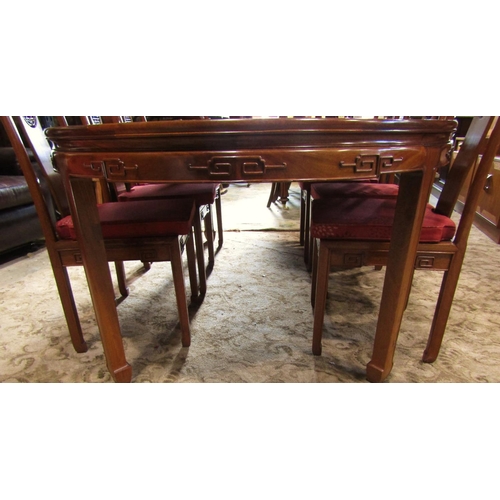 2312 - A Chinese hardwood D end extending dining table, the panelled top with two additional leaves raised ... 