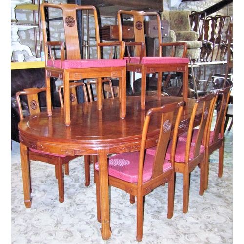 2312 - A Chinese hardwood D end extending dining table, the panelled top with two additional leaves raised ... 