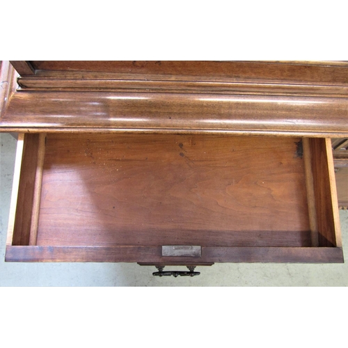 2339 - A good quality two sectional side cabinet in walnut, the upper with blind fret frieze over three ast... 