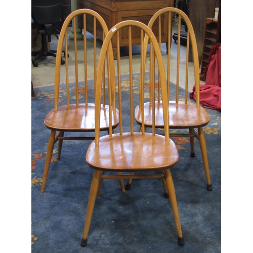 2367 - A set of three vintage Ercol light elm and beechwood high hoop and stickback dining chairs