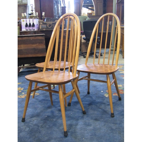 2367 - A set of three vintage Ercol light elm and beechwood high hoop and stickback dining chairs