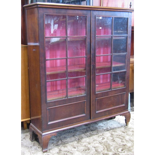 2396 - A 19th century mahogany side cabinet, free standing and enclosed by a pair of partially glazed and s... 