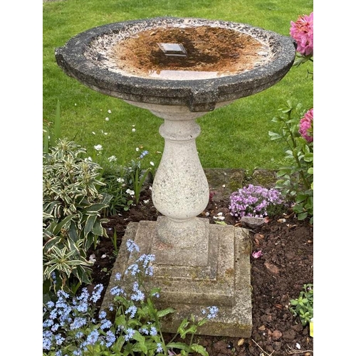 2066 - A reclaimed three sectional bird bath of circular form raised on a baluster shaped pillar and steppe... 