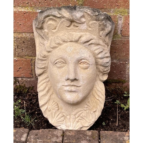 2068 - A reclaimed garden wall pocket female face mask with plaited hair and shell detail, 36 cm high x 26 ... 