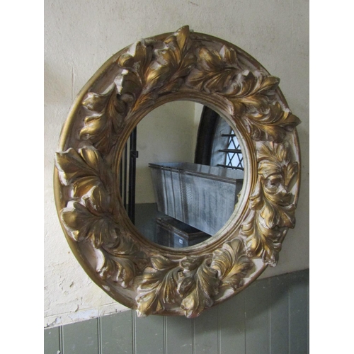 2428 - A large circular composite wall mirror with gilt reeded slip and deep acanthus surround, labelled ve... 