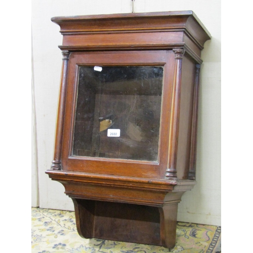 2680 - A Georgian oak wall mounted clock case, the hood with tapering column supports enclosing a 26cm glas... 