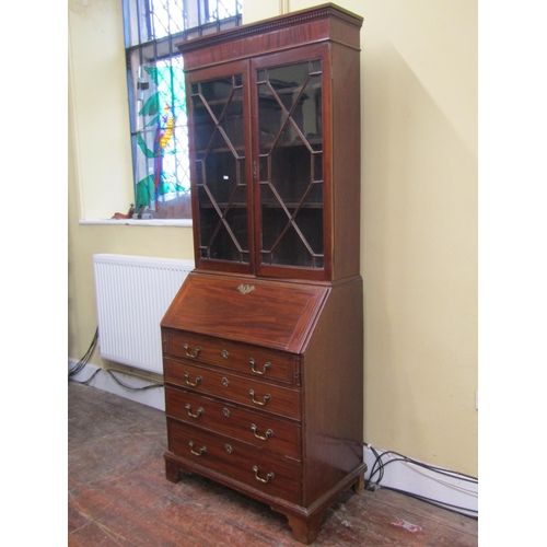 2778 - An Edwardian mahogany bureau bookcase, the bureau of four long drawers, the fall flap enclosing a fi... 