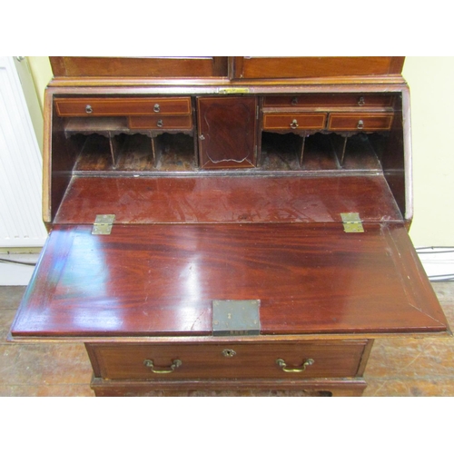 2778 - An Edwardian mahogany bureau bookcase, the bureau of four long drawers, the fall flap enclosing a fi... 