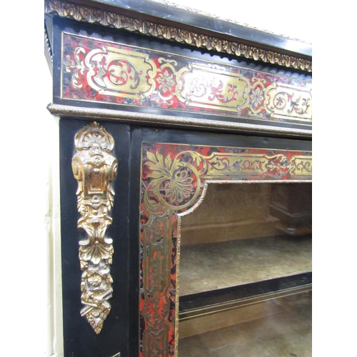 2820 - A good 19th century Boulle  pier cabinet set within an ebonised frame, the front elevation enclosed ... 