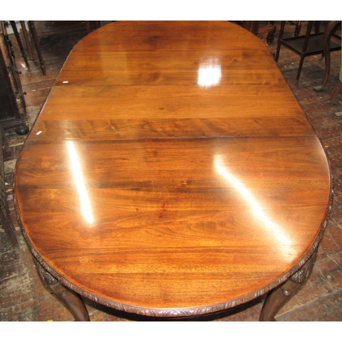 2805 - A good quality walnut D end extending dining table enclosing two additional leaves with carved and f... 