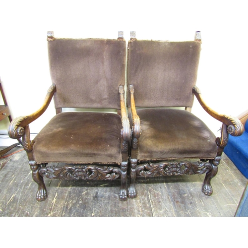 2824 - A pair of 19th century open armchairs in the Carolean manner, the beechwood frames with acanthus, li... 