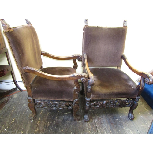 2824 - A pair of 19th century open armchairs in the Carolean manner, the beechwood frames with acanthus, li... 