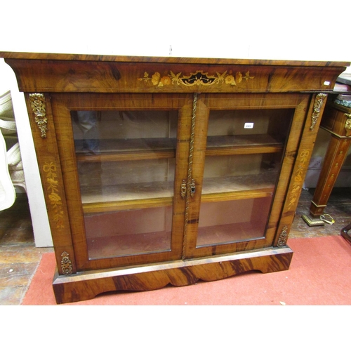 2821 - A mid Victorian period walnut side cabinet, enclosed by two glazed panelled doors, with floral marqu... 