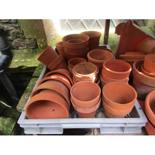 2066 - A large quantity (100+) reclaimed terracotta flower pots of varying size, a number weathered (af)