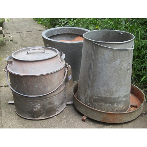 2067 - A galvanised steel feeder and two further galvanised vessels of varying design, two vintage, one con... 