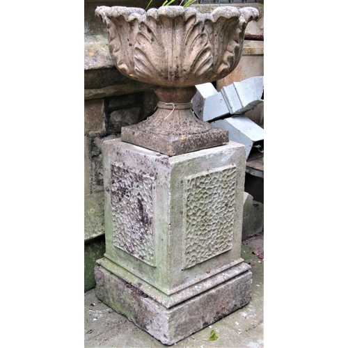 2074 - A reclaimed garden urn with acanthus leaf bowl and combined socle, raised on an associated square cu... 