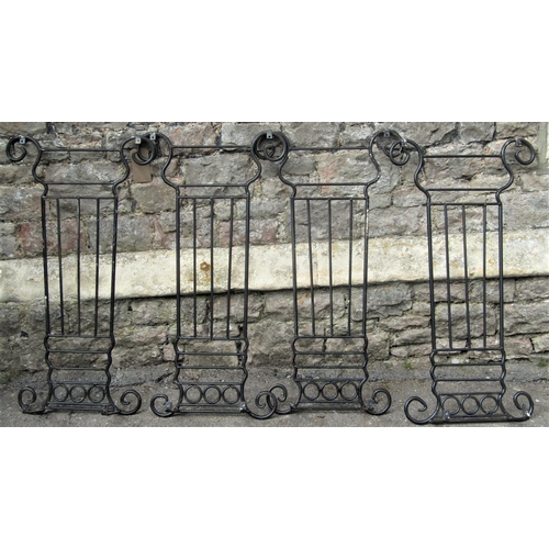 2075 - Four lyre shaped sections of iron railing, with ring and simple scroll detail, each panel 50cm wide ... 