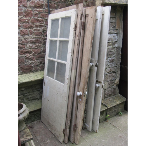 2083 - Eleven reclaimed pine doors, eight painted and three stripped, varying in size and design, mainly qu... 