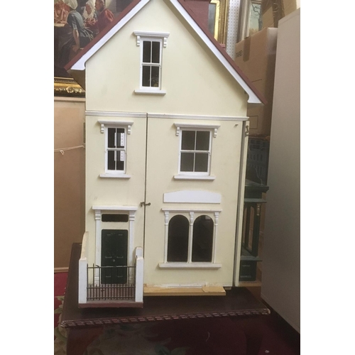 80 - Large dolls house with attractive flower shop frontage, interior is largely unfurnished and undecora... 