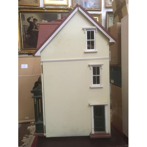 80 - Large dolls house with attractive flower shop frontage, interior is largely unfurnished and undecora... 