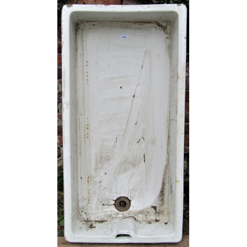 2089 - A large reclaimed white glazed stoneware butlers sink of rectangular form, 120cm long x 61cm wide x ... 