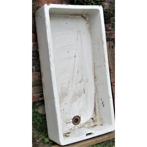 2089 - A large reclaimed white glazed stoneware butlers sink of rectangular form, 120cm long x 61cm wide x ... 