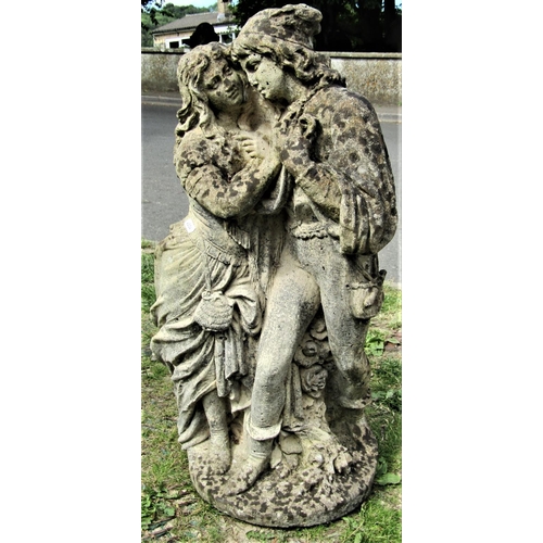 2114 - A weathered reclaimed garden ornament in the form of male and female romantic couple, 72 cm high